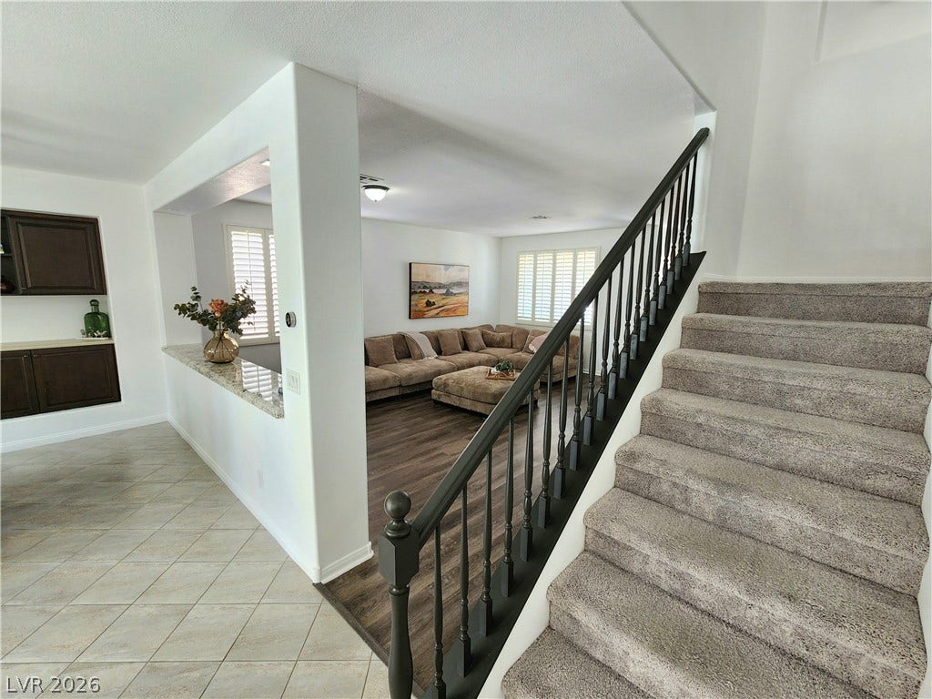 2743 Peekskill Avenue, Henderson, NV 89052 This inviting interior features elegant flooring and a well-designed stairway for seamless flow.