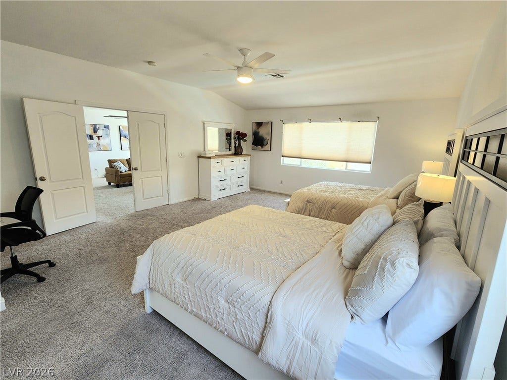 2743 Peekskill Avenue, Henderson, NV 89052 This spacious bedroom offers comfortable living with soft carpet and abundant natural light.