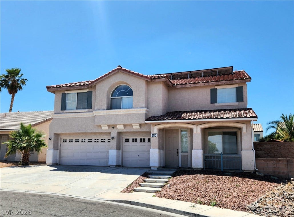 2743 Peekskill Avenue, Henderson, NV 89052 This residence features a tiled roof and an integrated two-car garage.