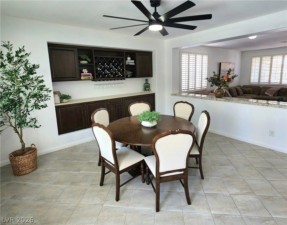 2743 Peekskill Avenue, Henderson, NV 89052 This inviting dining area features a built-in dry bar and tile flooring, perfect for entertaining.