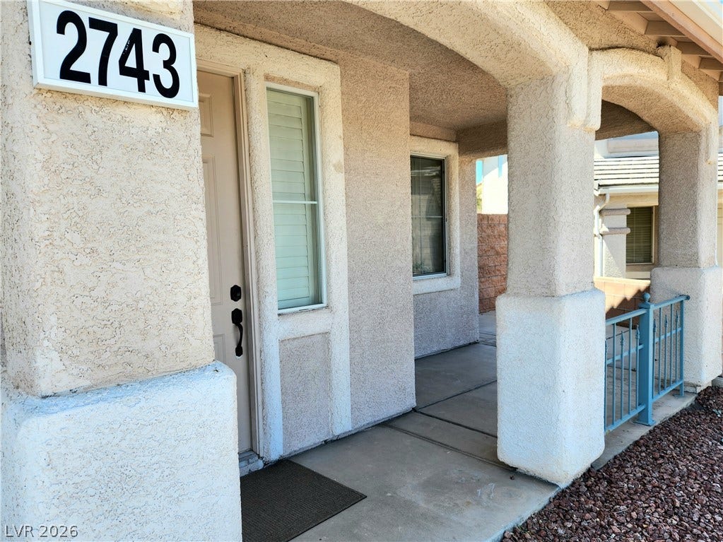 2743 Peekskill Avenue, Henderson, NV 89052 This inviting porch entry offers covered outdoor space, perfect for welcoming guests.