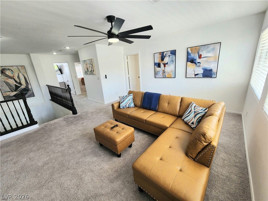 2743 Peekskill Avenue, Henderson, NV 89052 This inviting living area boasts plush carpeting and abundant natural light.
