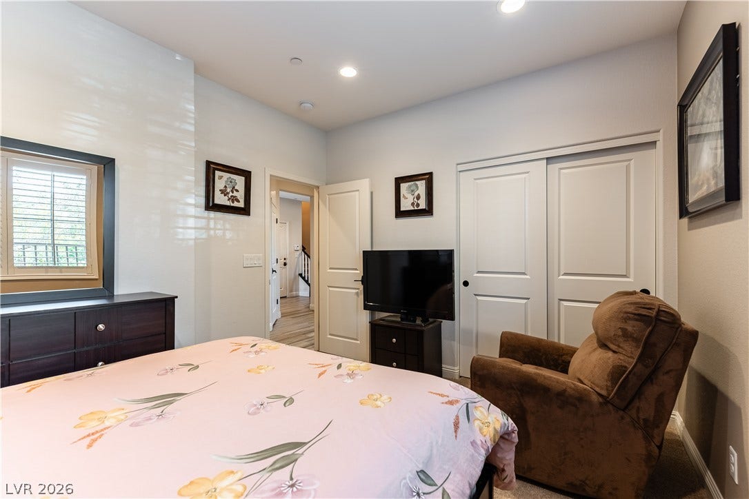 900 San Laurent Court, Henderson, NV 89012 Recessed lighting illuminates a well-appointed bedroom, offering comfort and privacy.