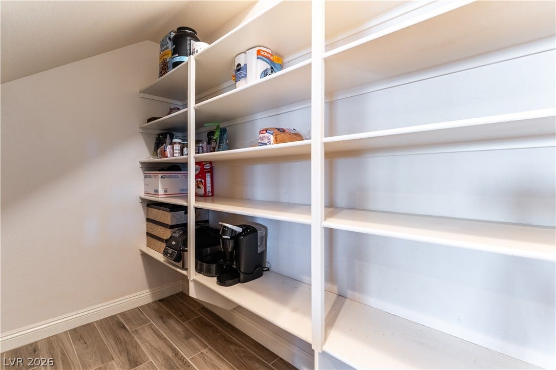 900 San Laurent Court, Henderson, NV 89012 Ample built-in shelving provides generous storage space, complementing the wood-look tile flooring.