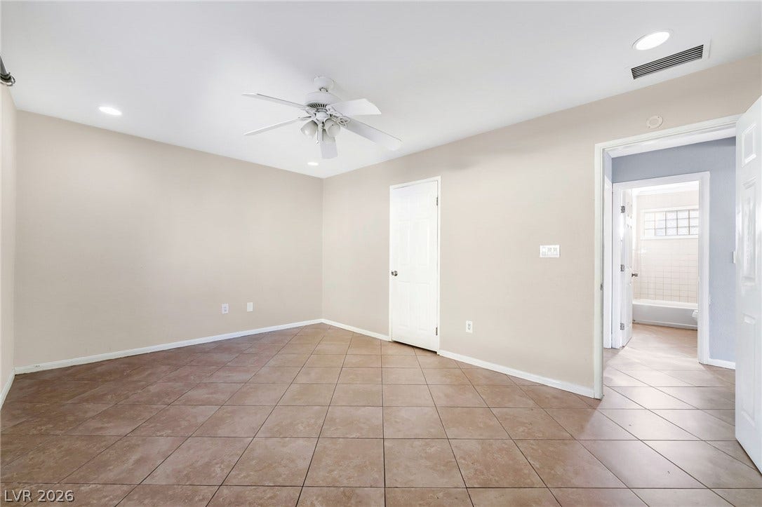 A quiet space with neutral walls and durable tiled flooring.