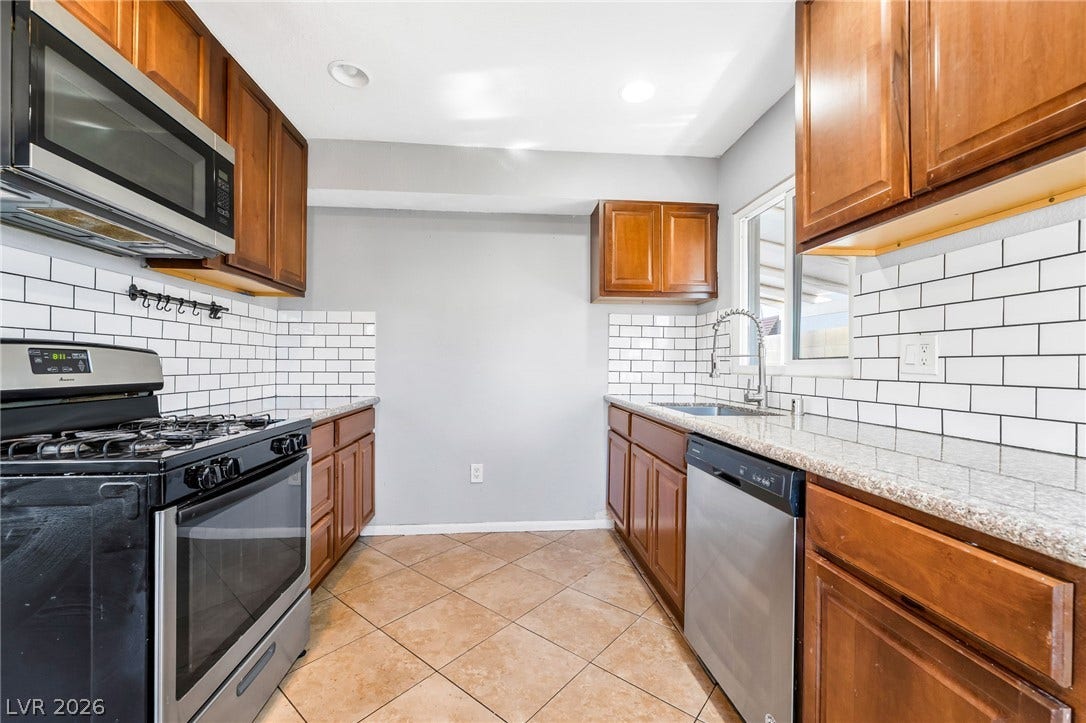 Functional kitchen with ample cabinet space and modern appliances ready for your culinary adventures.
