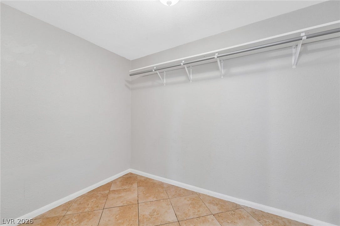 Ample storage space with practical shelving and a clothing rod, perfect for organization.