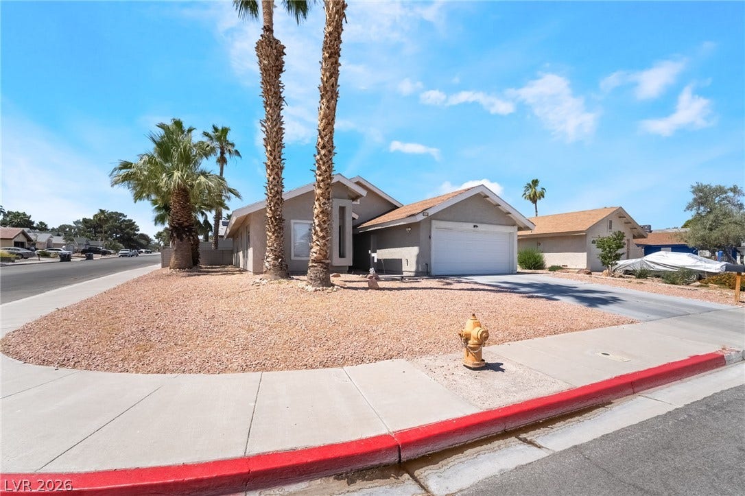 3111 Belvedere Drive, Henderson, NV 89014 A desert-friendly landscape surrounds this charming single-story residence with an attached garage.