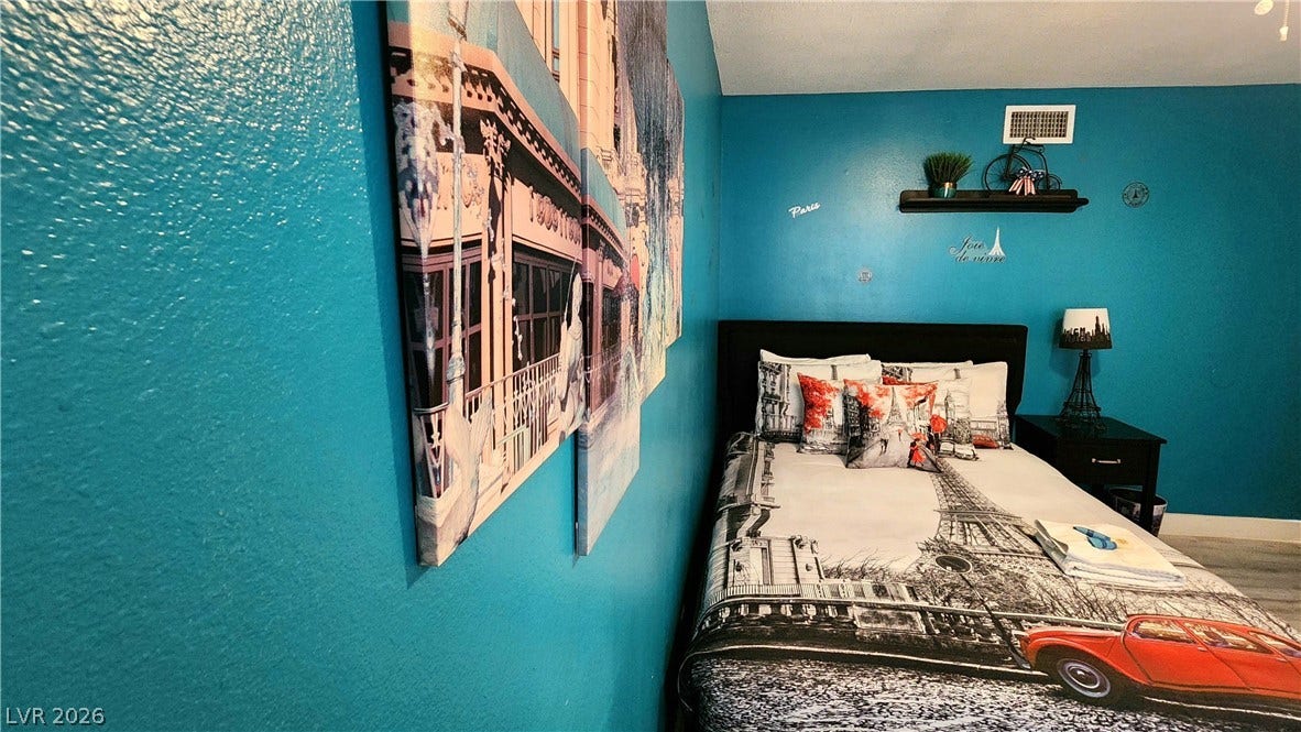 3111 Belvedere Drive, Henderson, NV 89014 A well-appointed bedroom features ample space and durable vinyl flooring for comfortable living.