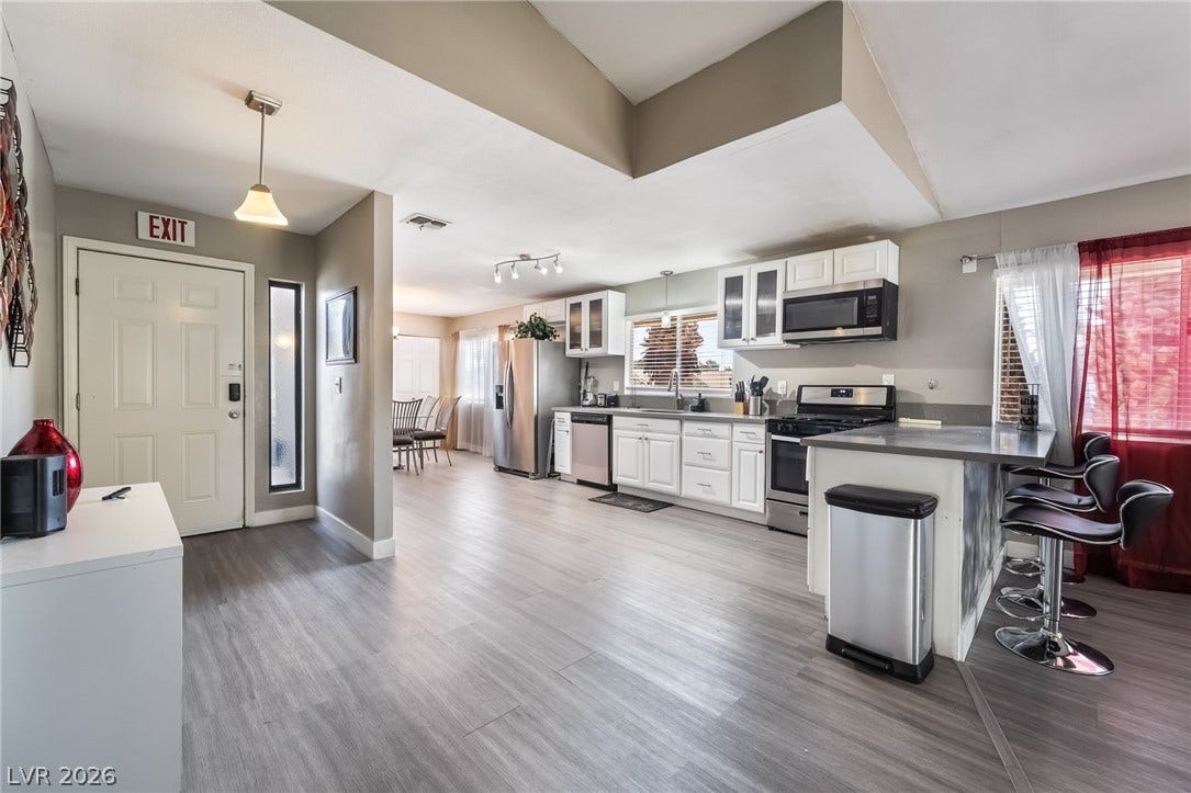 3111 Belvedere Drive, Henderson, NV 89014 An open concept kitchen features stainless steel appliances and durable flooring.
