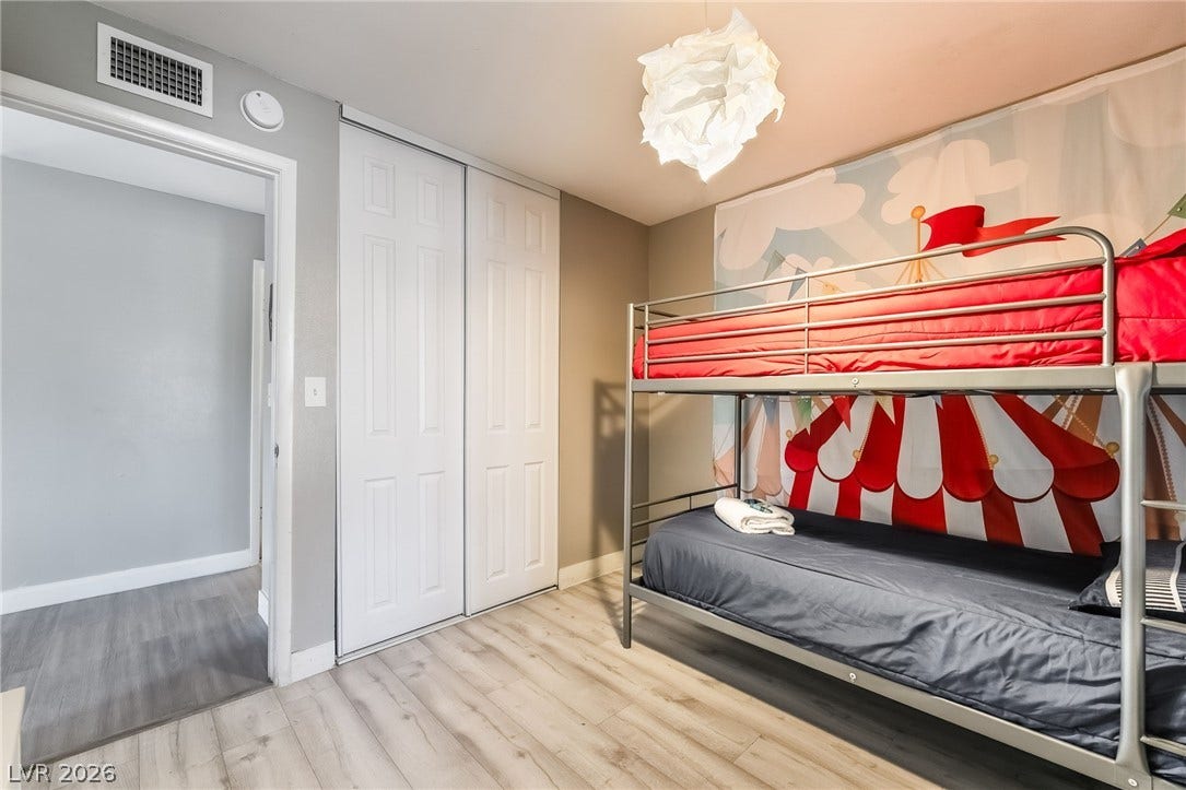 3111 Belvedere Drive, Henderson, NV 89014 A well-lit bedroom provides ample sleeping space with comfortable bunk beds.