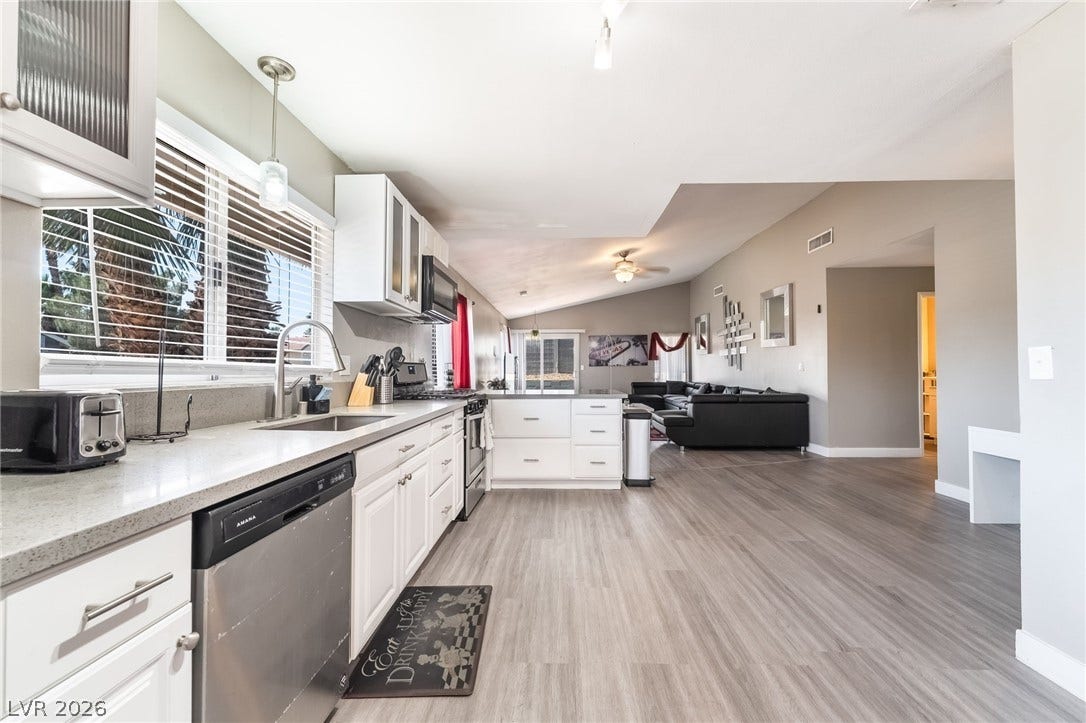 3111 Belvedere Drive, Henderson, NV 89014 An open-concept living space integrates a well-appointed kitchen with a comfortable living room.