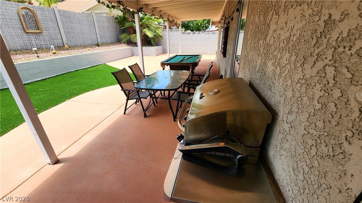 3111 Belvedere Drive, Henderson, NV 89014 A spacious covered patio provides an ideal setting for outdoor entertaining and relaxation.