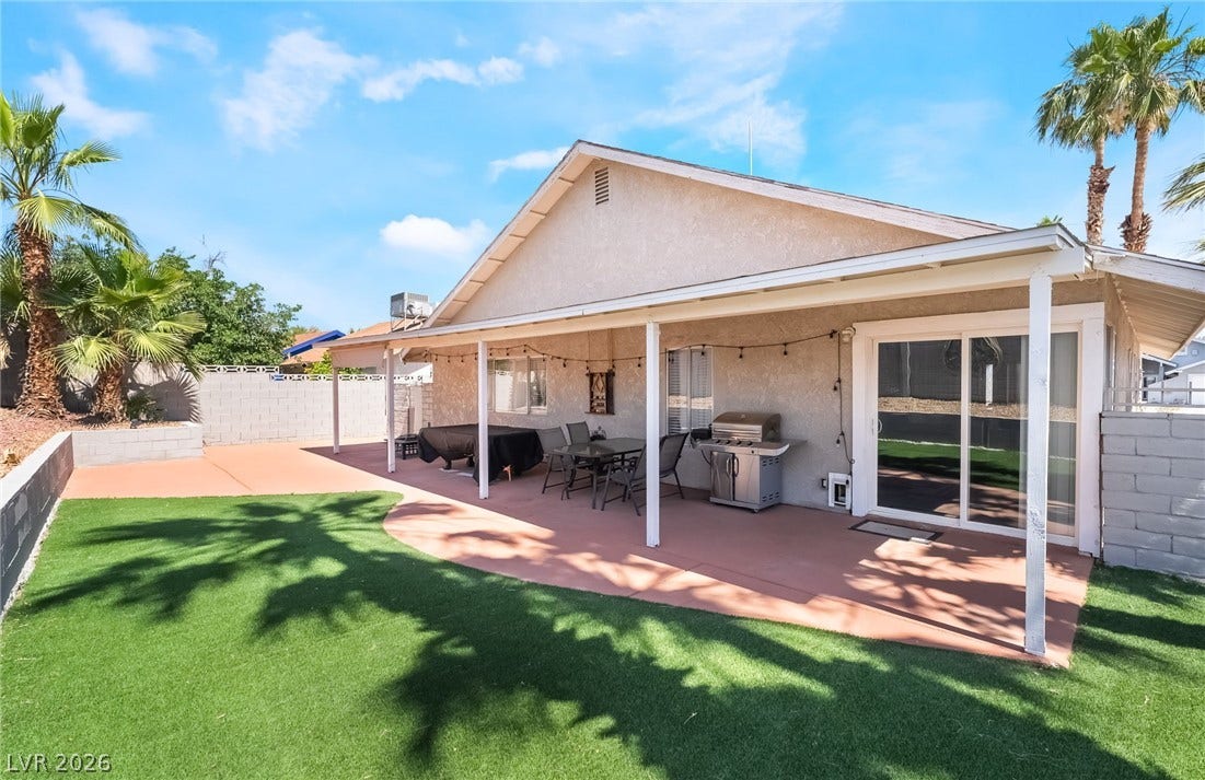 3111 Belvedere Drive, Henderson, NV 89014 A spacious backyard with a covered patio creates an ideal outdoor living space.