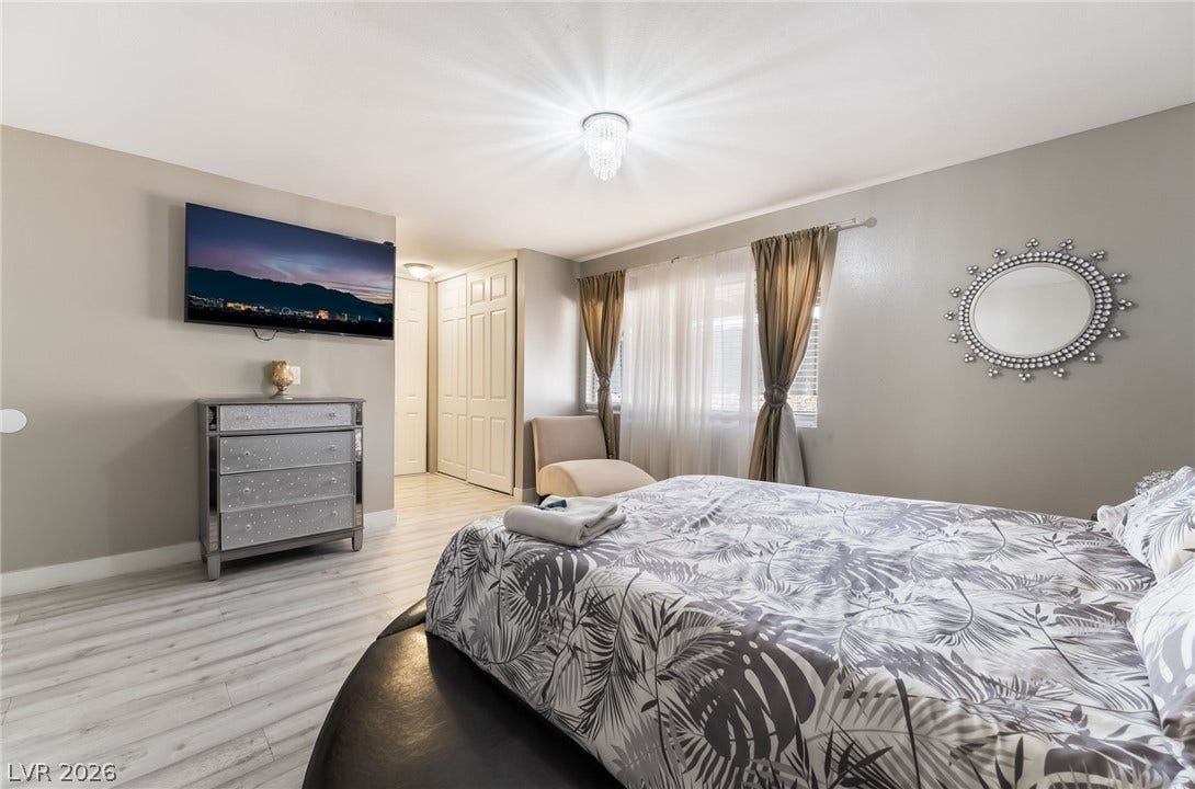 3111 Belvedere Drive, Henderson, NV 89014 Relaxation awaits in this naturally illuminated bedroom, complete with bright flooring and ample storage.