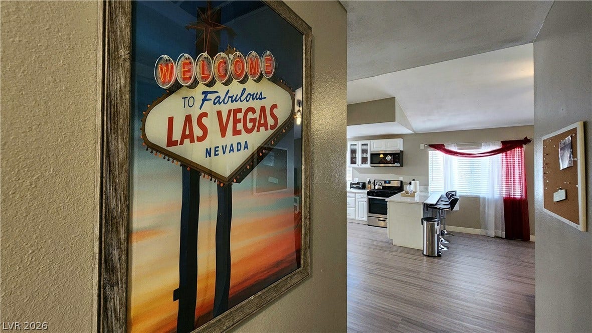 3111 Belvedere Drive, Henderson, NV 89014 A well-lit kitchen with sleek stainless steel appliances and a spacious island for dining or entertaining.