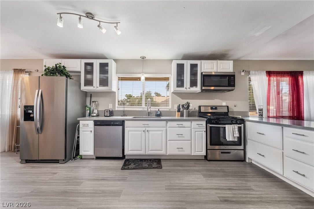 3111 Belvedere Drive, Henderson, NV 89014 A well-appointed kitchen showcasing contemporary appliances and abundant counter space.