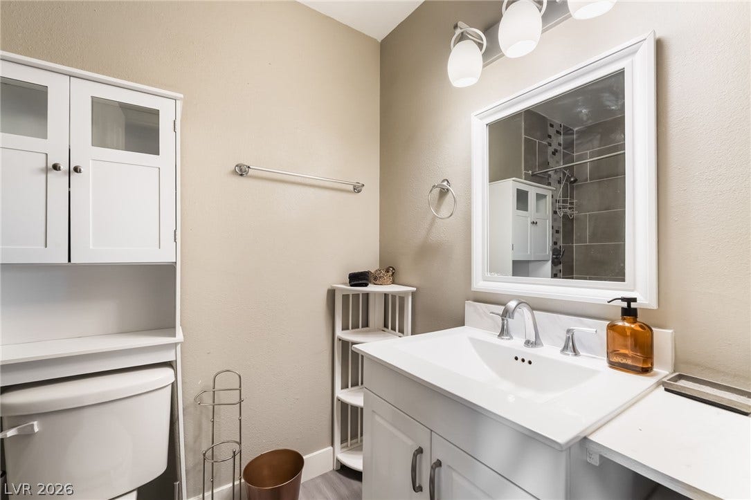 3111 Belvedere Drive, Henderson, NV 89014 A well-appointed bathroom with a modern vanity and ample storage offers a clean aesthetic.