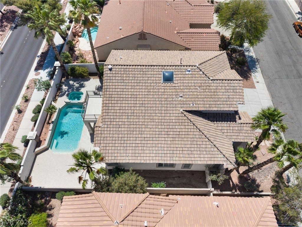 1278 Autumn Wind Way, Henderson, NV 89052 An aerial perspective reveals a private pool and spa, complementing the tile roof architecture.