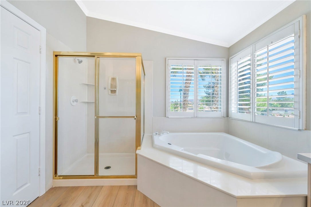 1278 Autumn Wind Way, Henderson, NV 89052 Indulge in a tranquil bathing experience within this generously proportioned primary bathroom, featuring a deep soaking tub.
