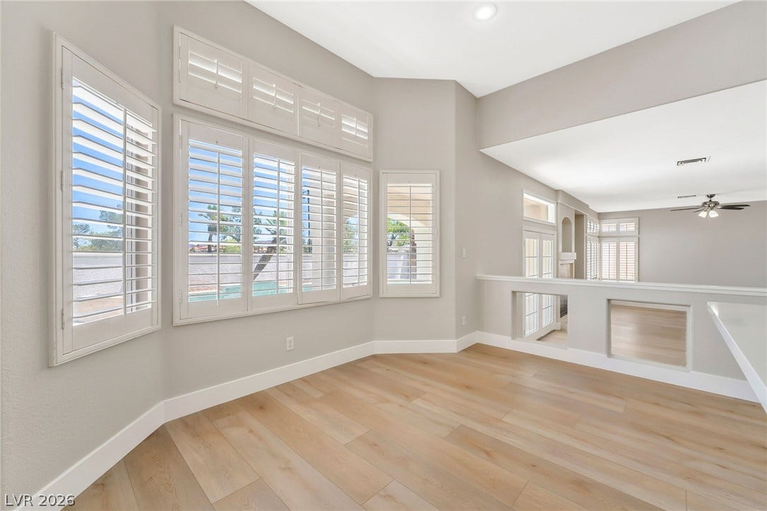1278 Autumn Wind Way, Henderson, NV 89052 A luminous living space features numerous windows, creating an airy and open ambiance.