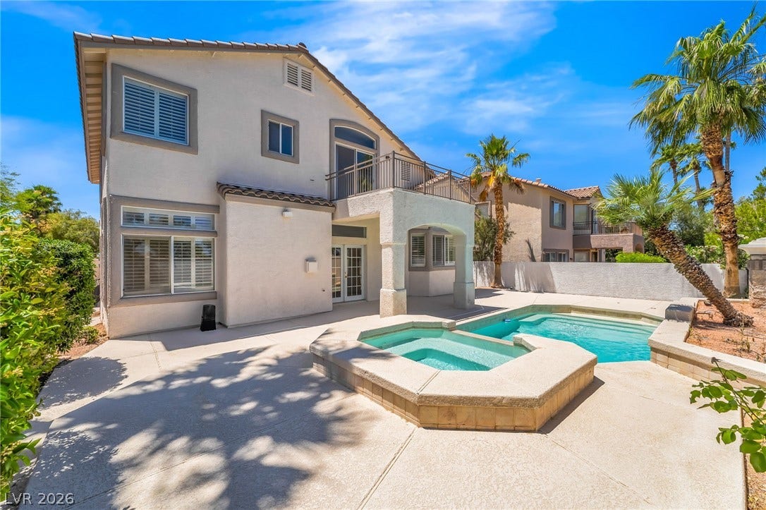1278 Autumn Wind Way, Henderson, NV 89052 An inviting backyard oasis offers a sparkling pool and spa, perfect for relaxation or entertaining.