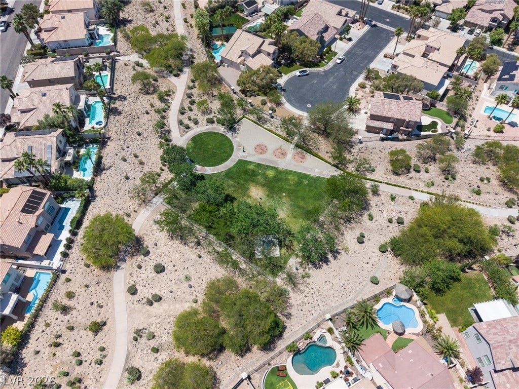 1278 Autumn Wind Way, Henderson, NV 89052 An aerial perspective showcases a residential neighborhood with green spaces and meandering paths.