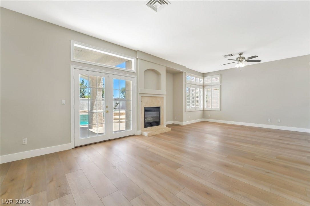 1278 Autumn Wind Way, Henderson, NV 89052 Hardwood floors and a cozy fireplace anchor this inviting living space.