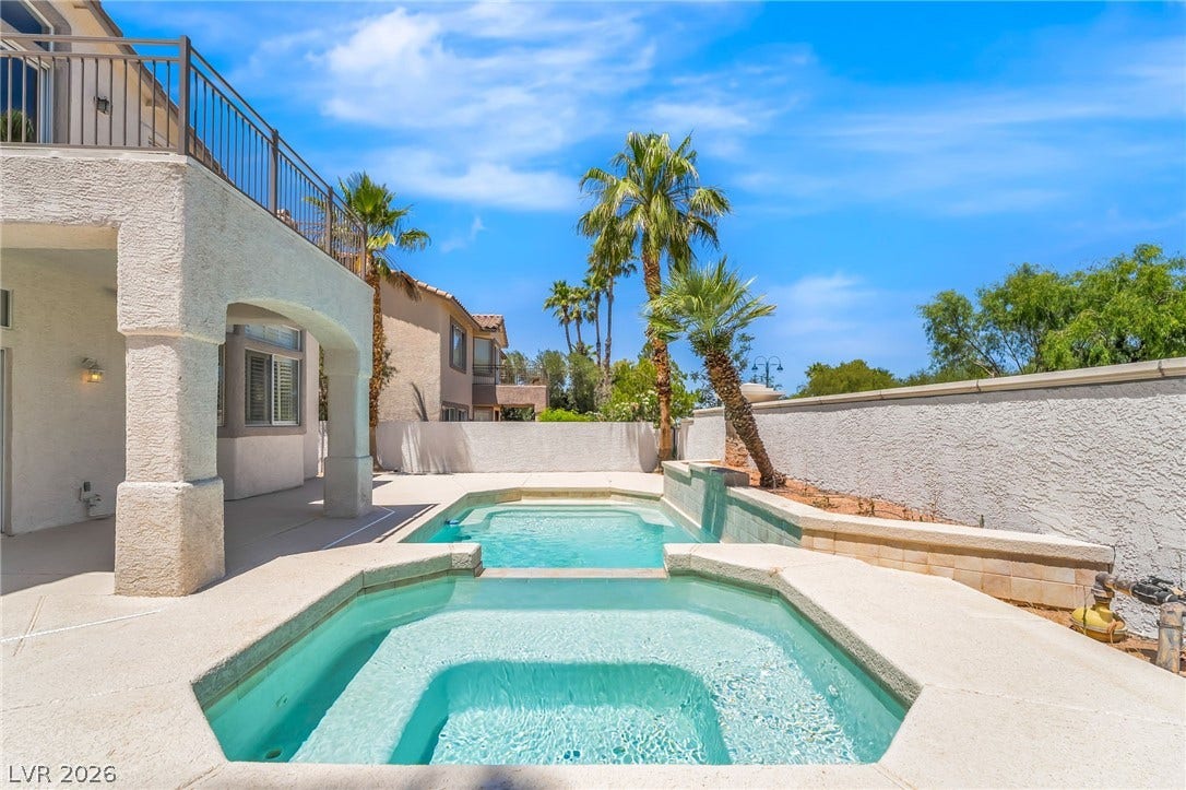1278 Autumn Wind Way, Henderson, NV 89052 A private outdoor oasis, offering a sparkling pool and spa, perfect for relaxation or entertaining.