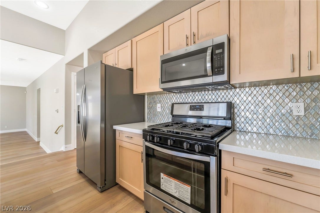 1278 Autumn Wind Way, Henderson, NV 89052 Culinary delights await in this bright kitchen with stainless steel appliances and abundant cabinetry.