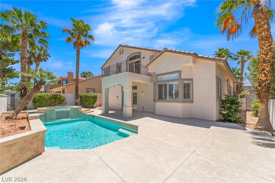 1278 Autumn Wind Way, Henderson, NV 89052 An inviting backyard oasis awaits with a sparkling pool, elevated spa, and private balcony.