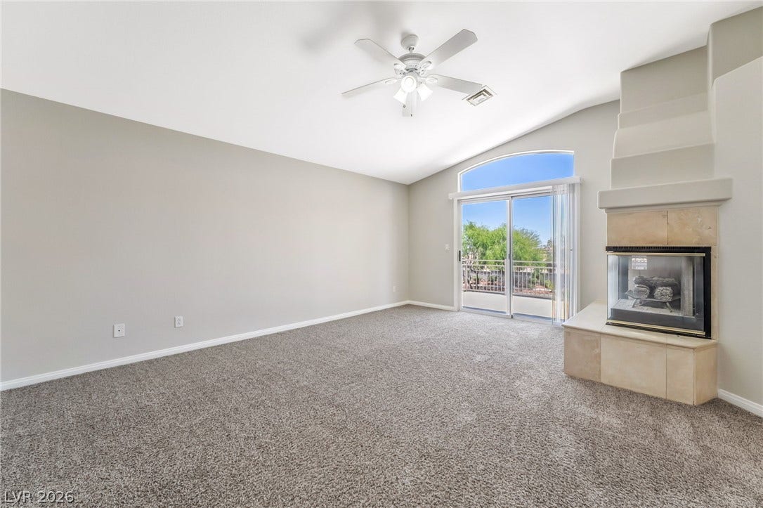 1278 Autumn Wind Way, Henderson, NV 89052 A lofty ceiling and fireplace create a cozy yet open ambiance.