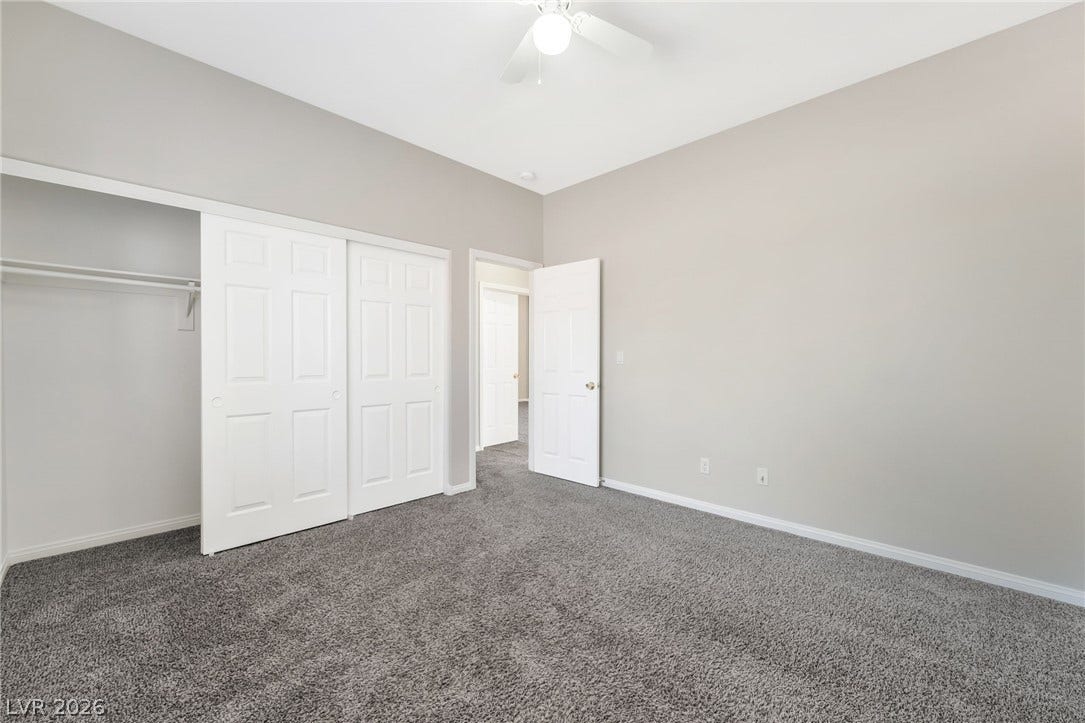 1278 Autumn Wind Way, Henderson, NV 89052 A comfortable bedroom features plush carpeting and a convenient sliding door closet.