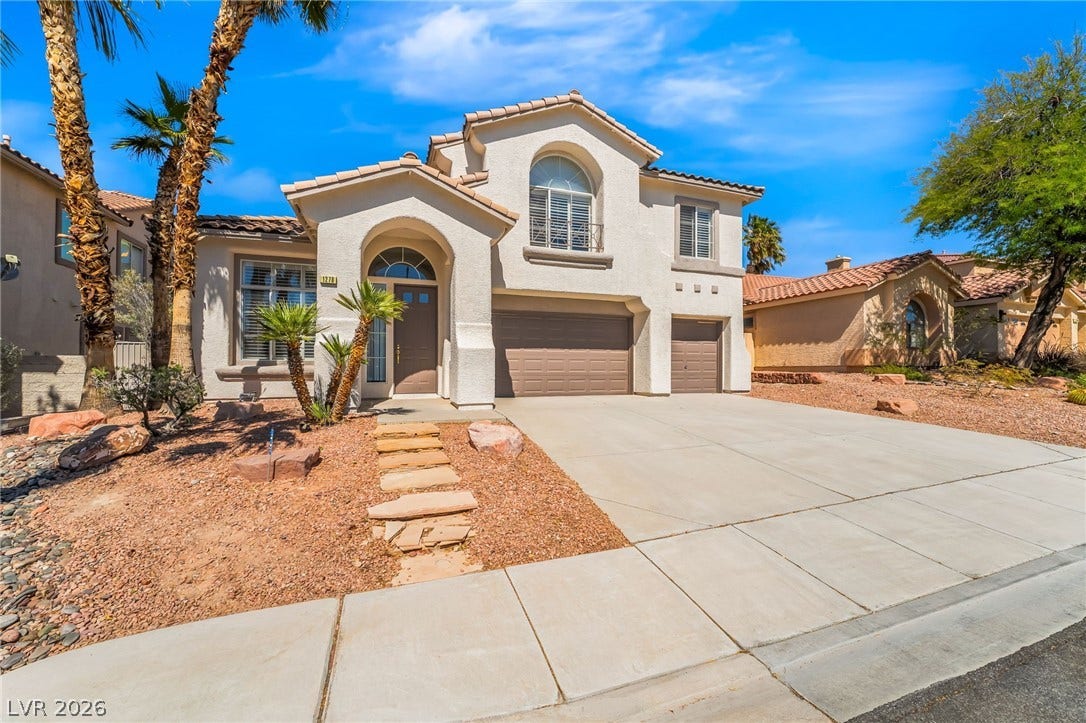 1278 Autumn Wind Way, Henderson, NV 89052 An inviting entry leads to this two-story desert oasis with a multi-car garage.