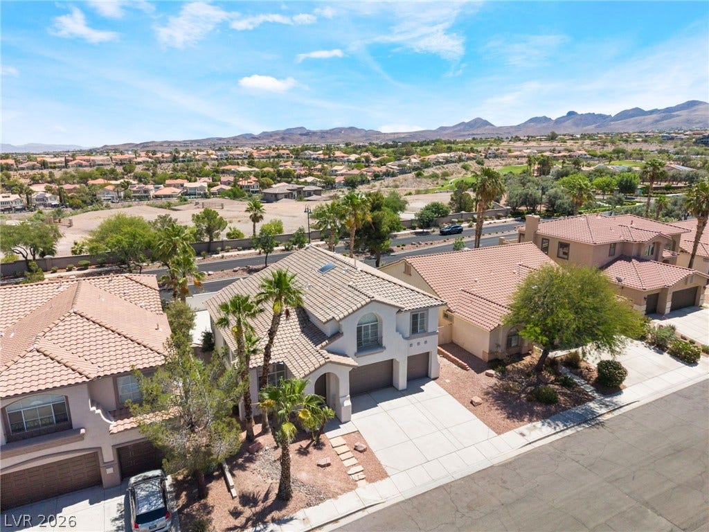 1278 Autumn Wind Way, Henderson, NV 89052 Discover a neighborhood with mature trees and mountain backdrops, offering a serene desert living experience.