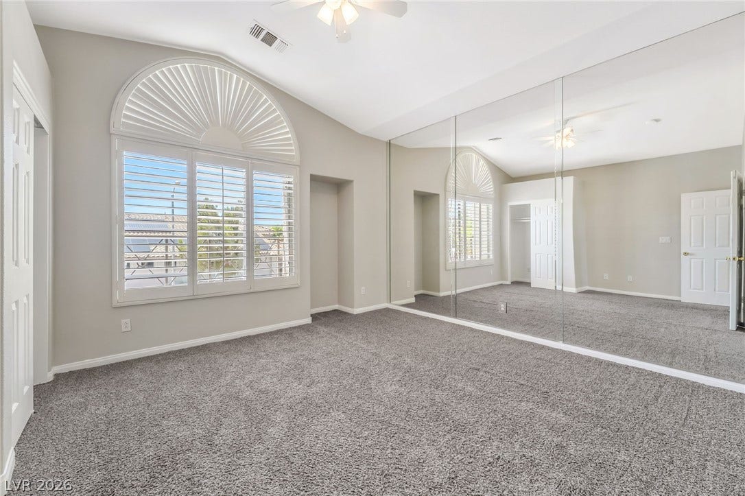 1278 Autumn Wind Way, Henderson, NV 89052 Natural illumination fills this room, complemented by mirrored walls and vaulted ceilings.