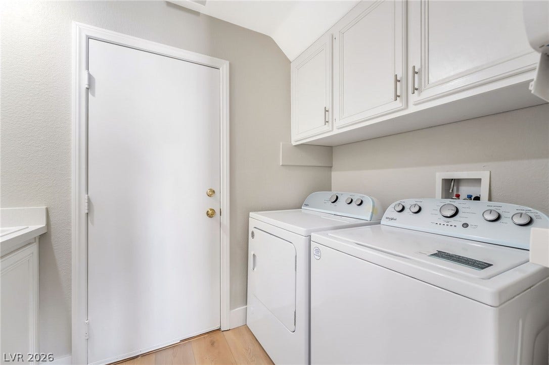 1278 Autumn Wind Way, Henderson, NV 89052 Functional laundry space featuring modern appliances and convenient overhead cabinetry.