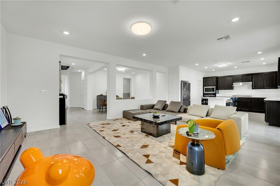 7710 Weekes Court, Las Vegas, NV 89113 Gleaming tile floors and recessed lighting enhance this airy, open-concept living space.