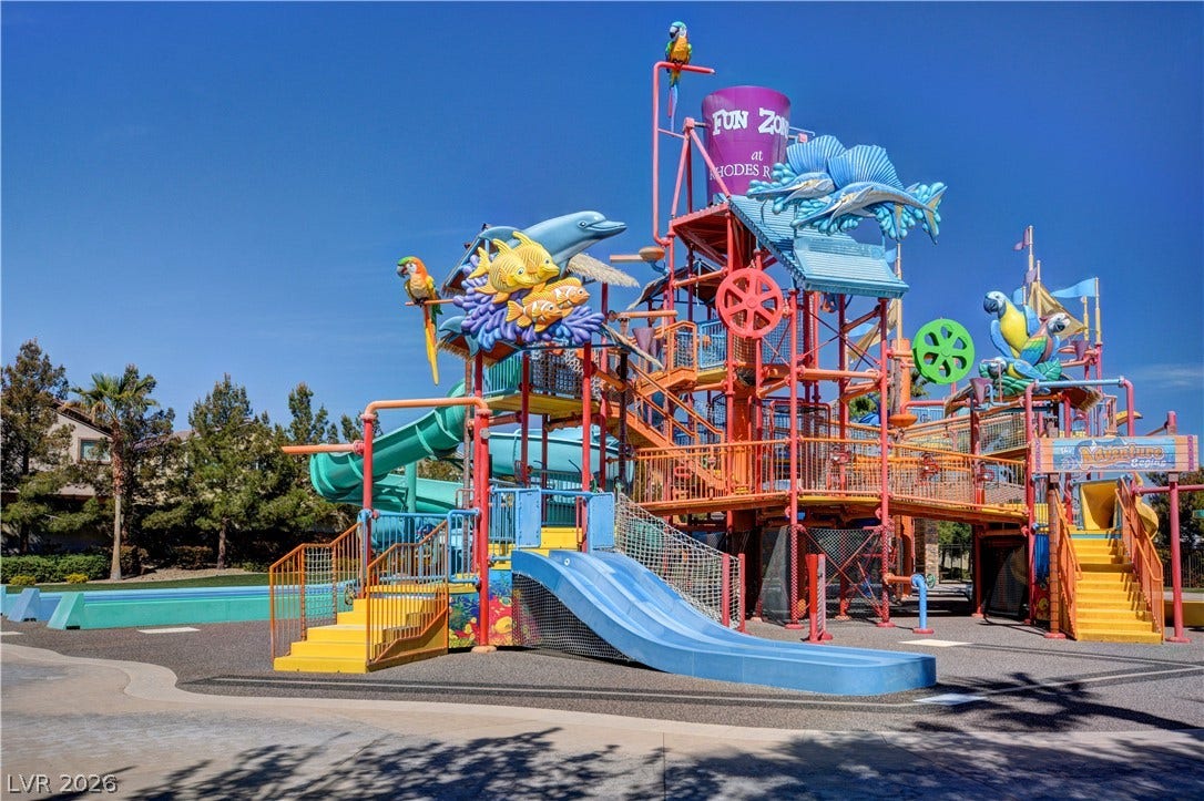 115 Cora Hills Court, Las Vegas, NV 89148 An aquatic adventure playground promises endless fun with vibrant slides and engaging water features.