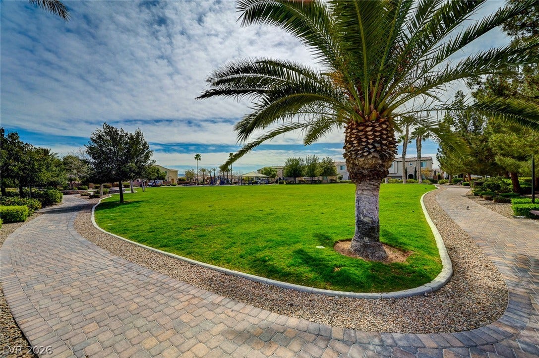 115 Cora Hills Court, Las Vegas, NV 89148 Meandering paved pathways wind through a vibrant green park space, ideal for community recreation.
