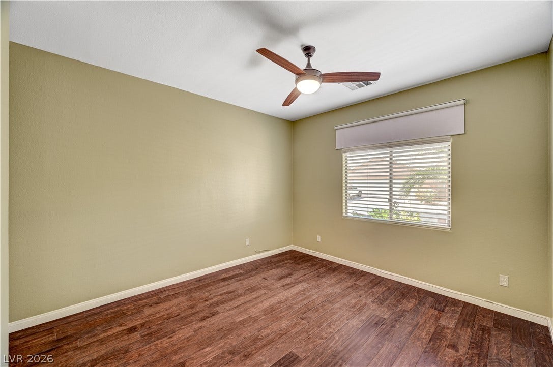 115 Cora Hills Court, Las Vegas, NV 89148 Hardwood flooring extends throughout this naturally illuminated, versatile bedroom.