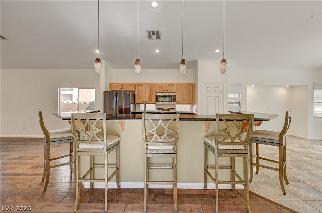 115 Cora Hills Court, Las Vegas, NV 89148 An inviting eat-in kitchen with generous counter space, ideal for casual dining and entertaining.
