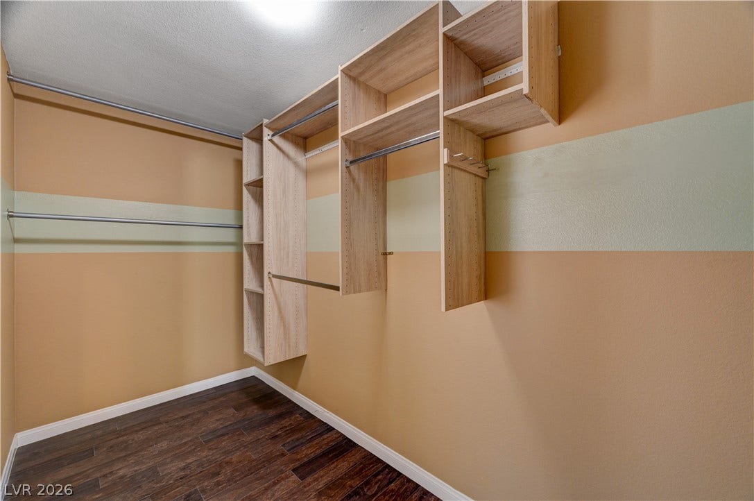 115 Cora Hills Court, Las Vegas, NV 89148 Ample shelving and hanging rods provide versatile storage in this well-appointed closet.