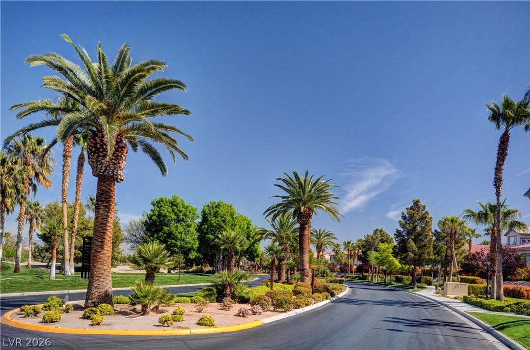 115 Cora Hills Court, Las Vegas, NV 89148 Palm-lined streets define this inviting neighborhood, with lush landscaping enhancing the curb appeal.
