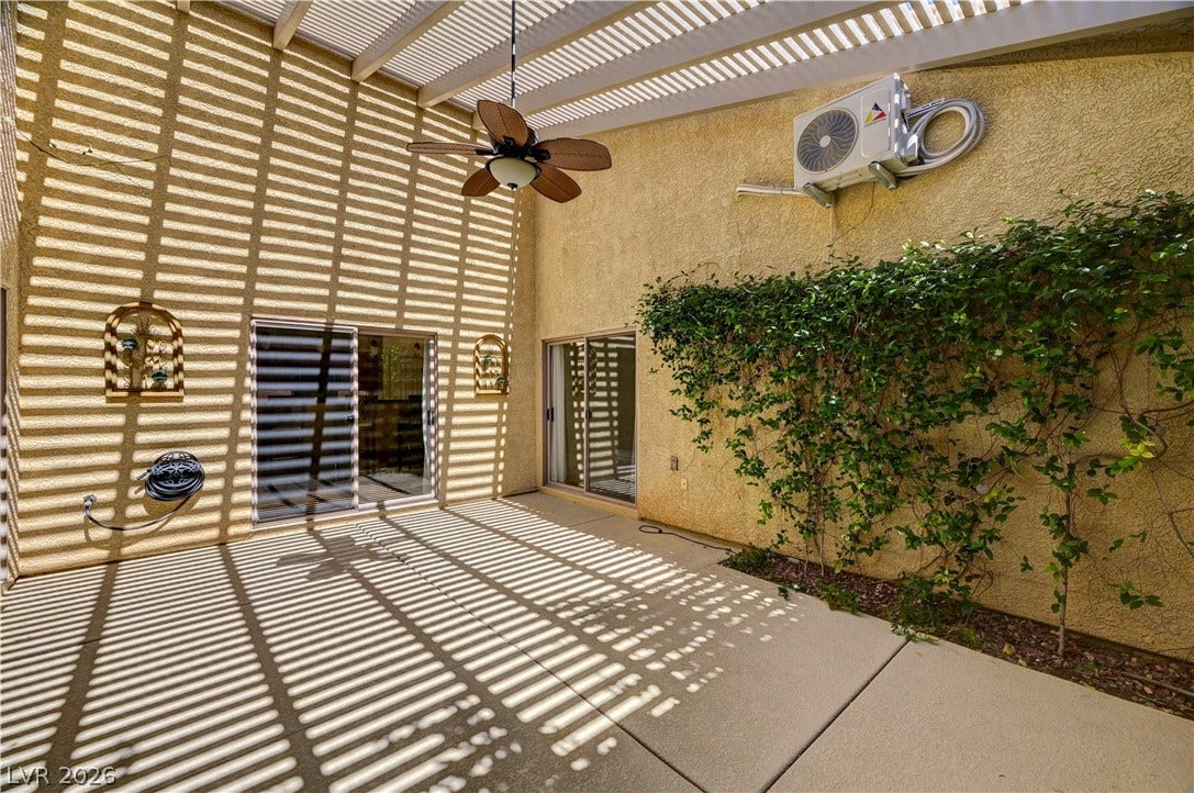 115 Cora Hills Court, Las Vegas, NV 89148 A well-lit patio area, perfect for al fresco dining, offers ample space for relaxation and enjoyment.