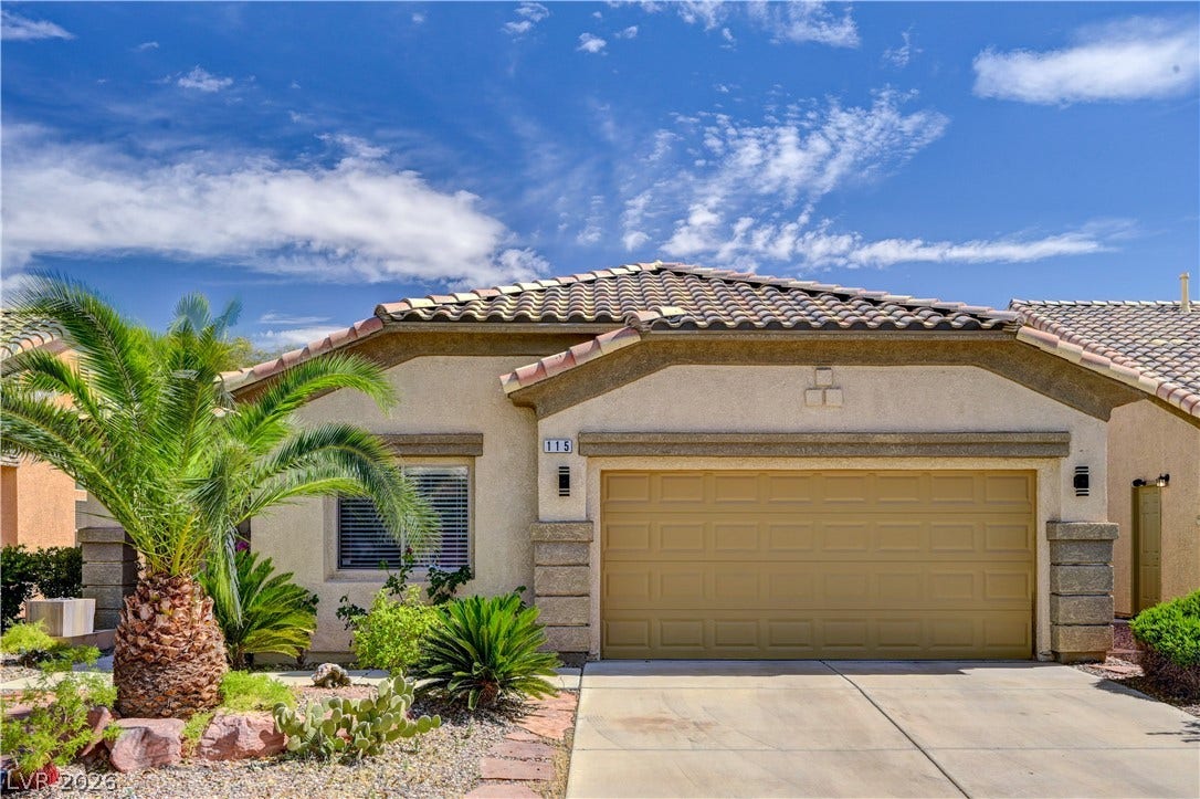 115 Cora Hills Court, Las Vegas, NV 89148 A desert-friendly landscape accents the appealing tiled roof and inviting entryway of this single-story home.