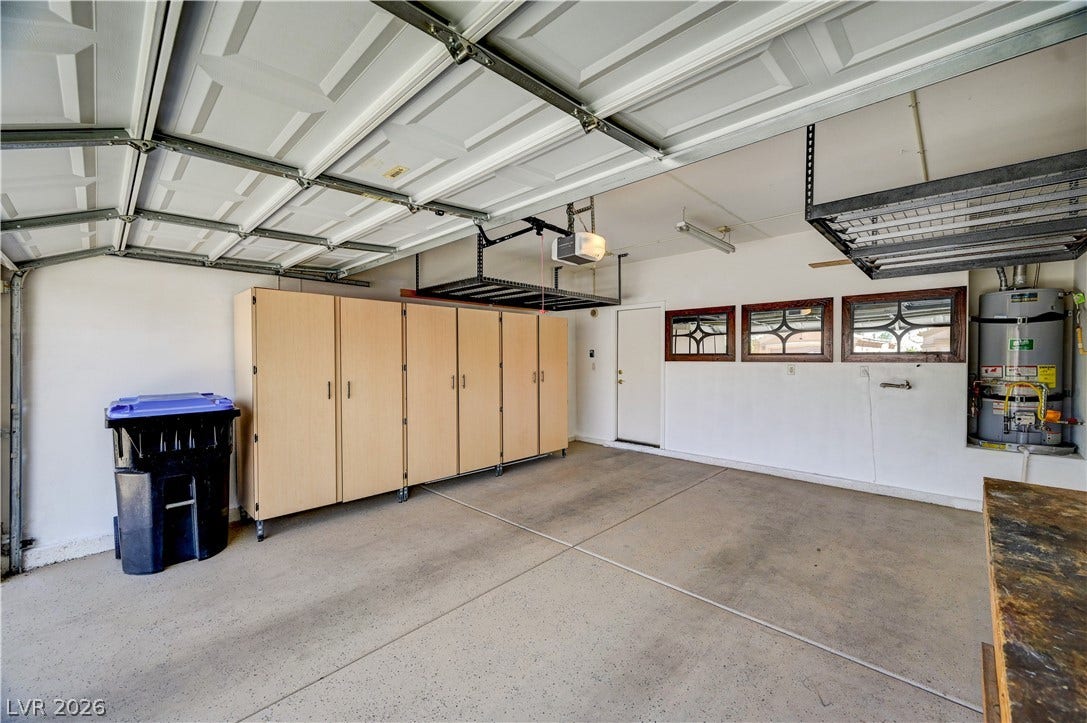 115 Cora Hills Court, Las Vegas, NV 89148 Ample storage solutions and durable flooring define this functional garage space.