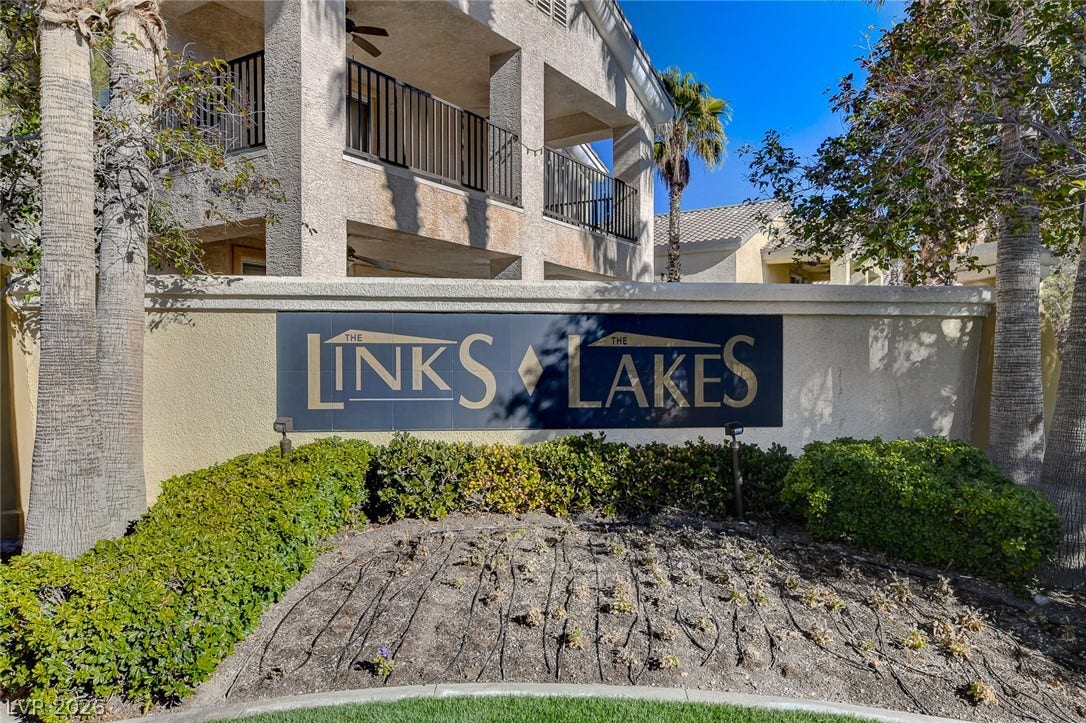 115 Cora Hills Court, Las Vegas, NV 89148 An inviting community entrance sign with lush landscaping welcomes residents and guests.