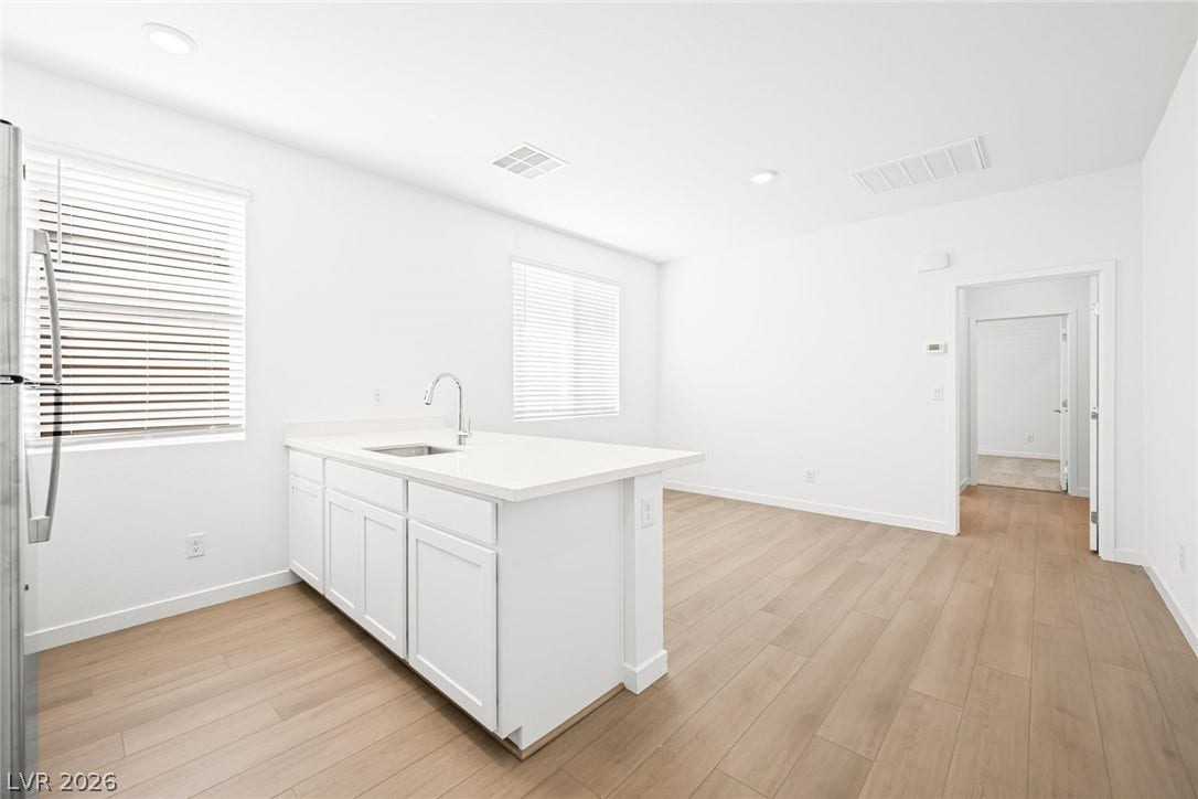 Bright open-concept kitchen with clean lines and generous counter space, perfect for entertaining.