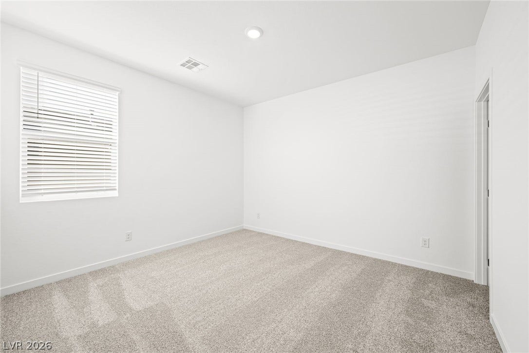 A well-lit, neutral-toned room ready for personalization.